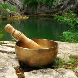 singing-bowl-placed-nature-with-river-background
